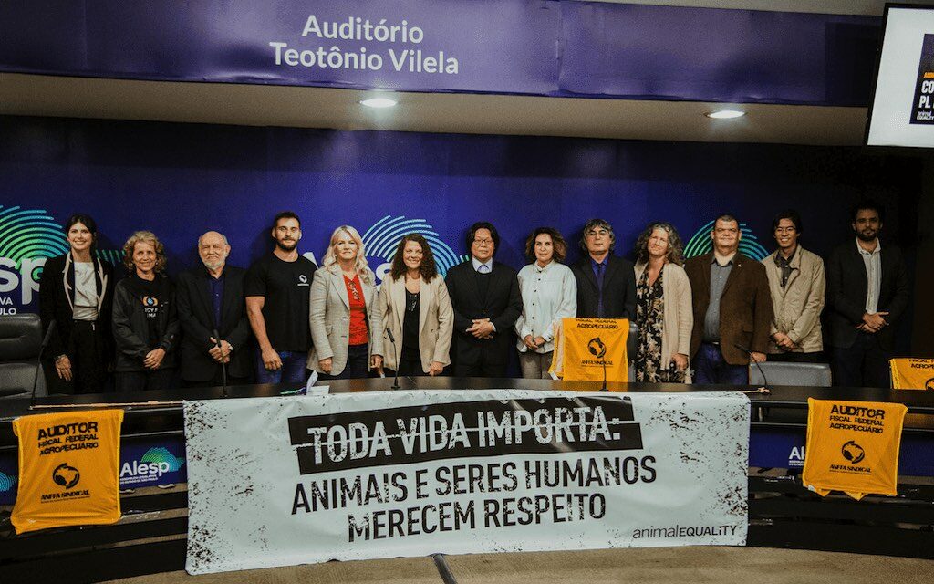 Carla Lettieri, Executive Director of Animal Equality in Brazil, with representatives from other organizations in the public hearing.